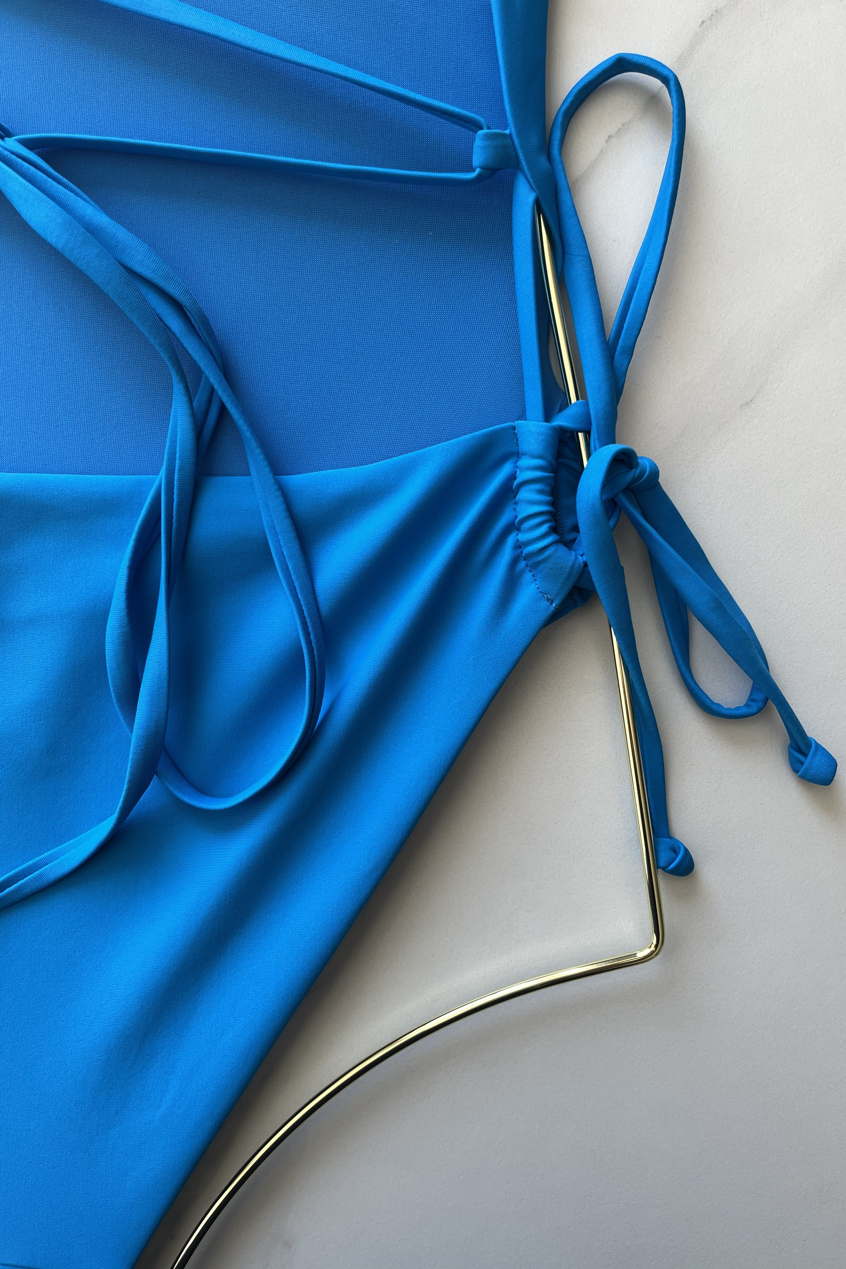 ESAMY The Twist Criss-Cross One-Piece Swimsuit in Azul - Light Blue Close-Up of Dig-Free Side String Ties